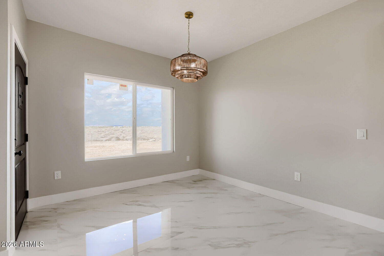 38420 West Buckeye Road Tonopah, AZ 85354 - Photo 11 of 28 a view of a room with a chandelier fan and windows