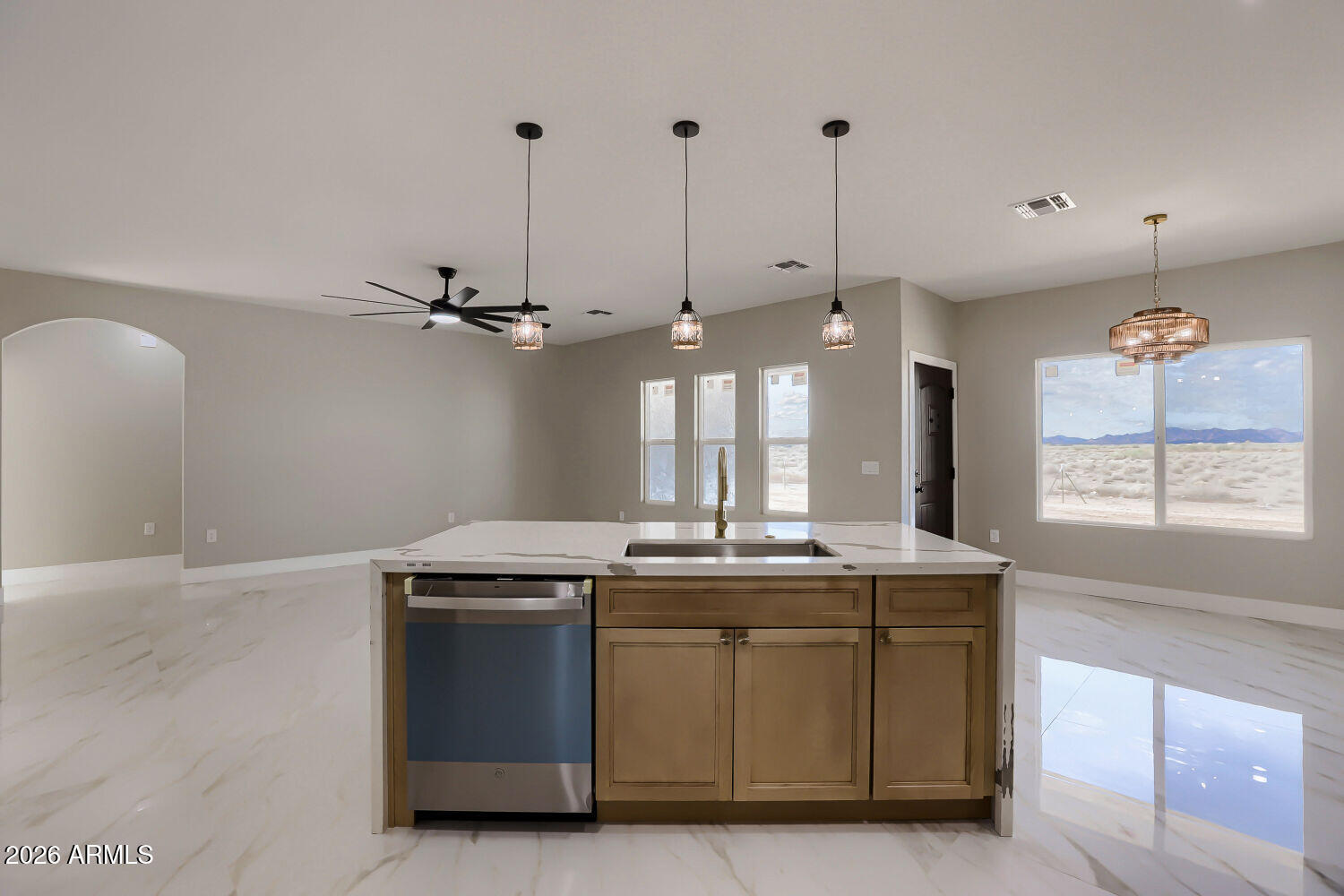 38420 West Buckeye Road Tonopah, AZ 85354 - Photo 12 of 28 a kitchen with a stove a window and chairs