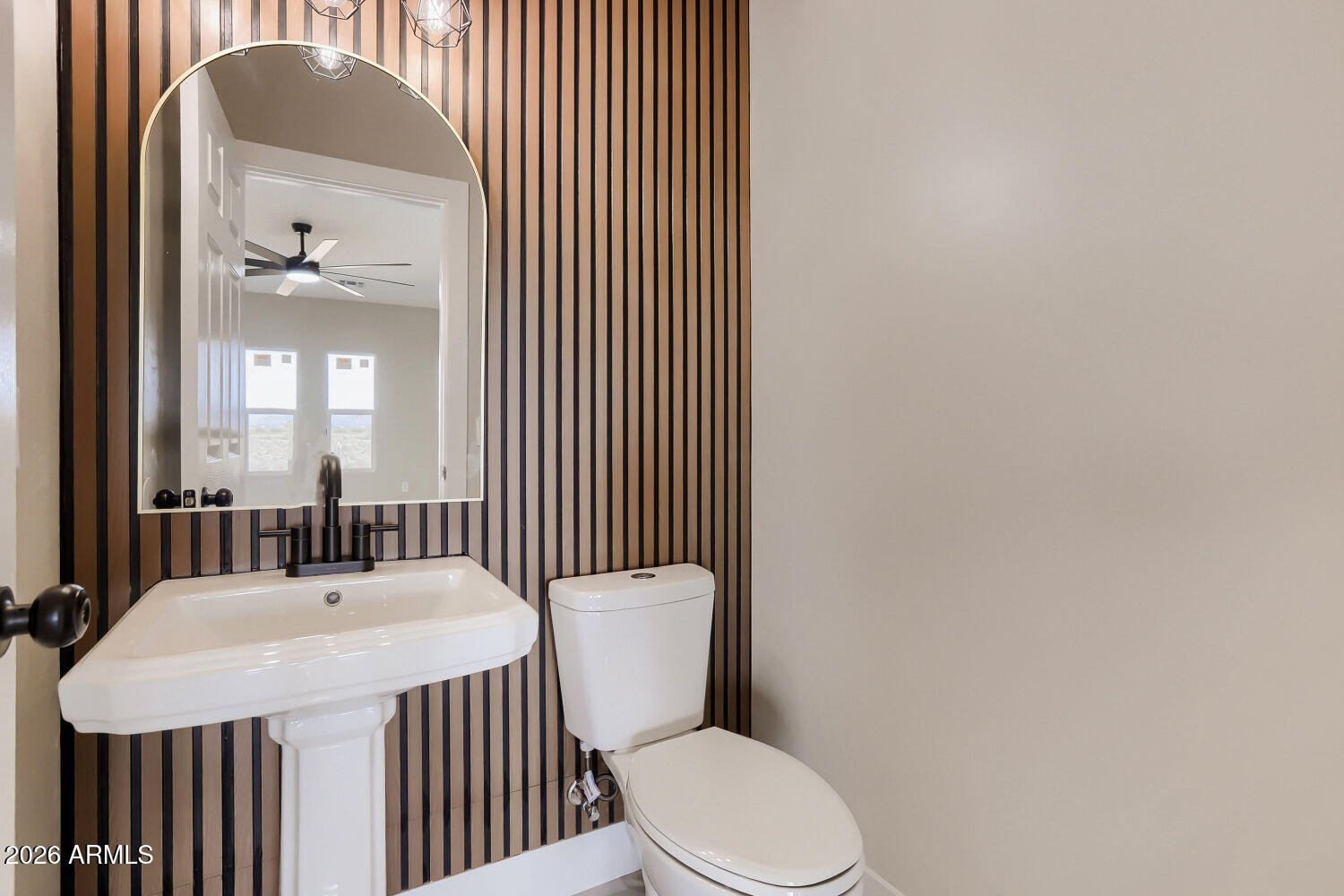 38420 West Buckeye Road Tonopah, AZ 85354 - Photo 13 of 28 a bathroom with a toilet a sink and mirror
