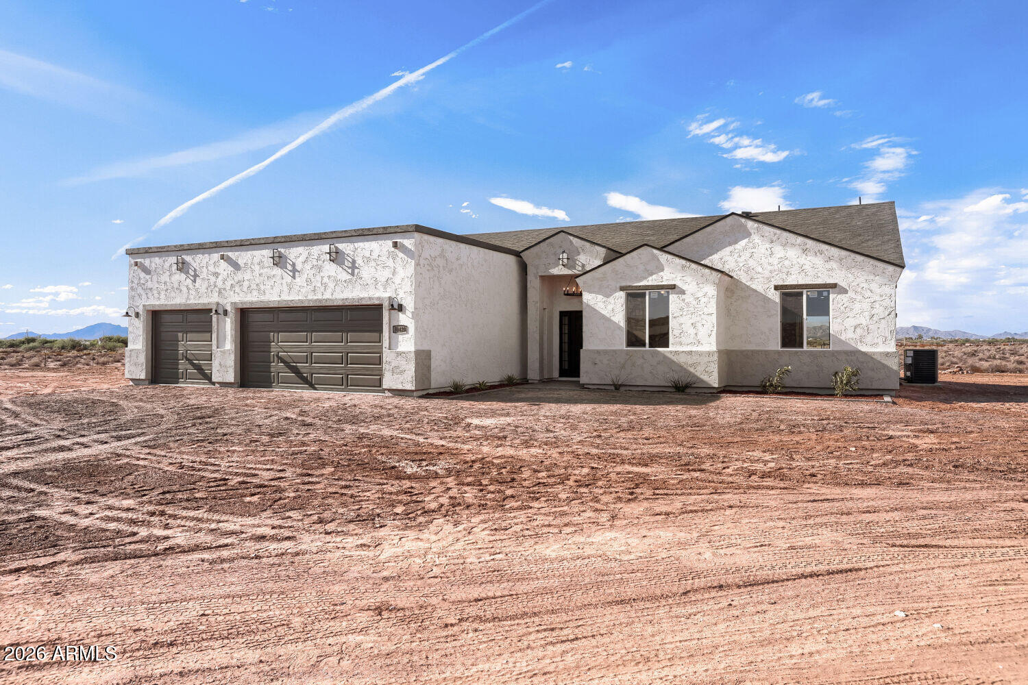 38420 West Buckeye Road Tonopah, AZ 85354 - Photo 3 of 28 a view of a house with a patio and a yard