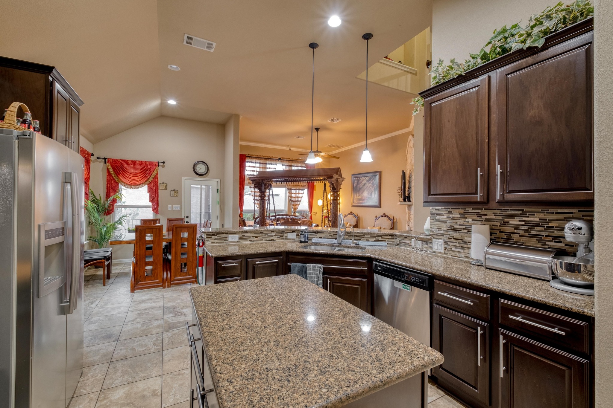 3040 Sachen Street Georgetown, TX 78626 - Photo 12 of 40 a kitchen with stainless steel appliances granite countertop a sink a stove and a refrigerator