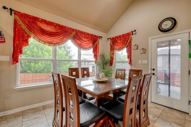 a view of a dining room with furniture window and outside view