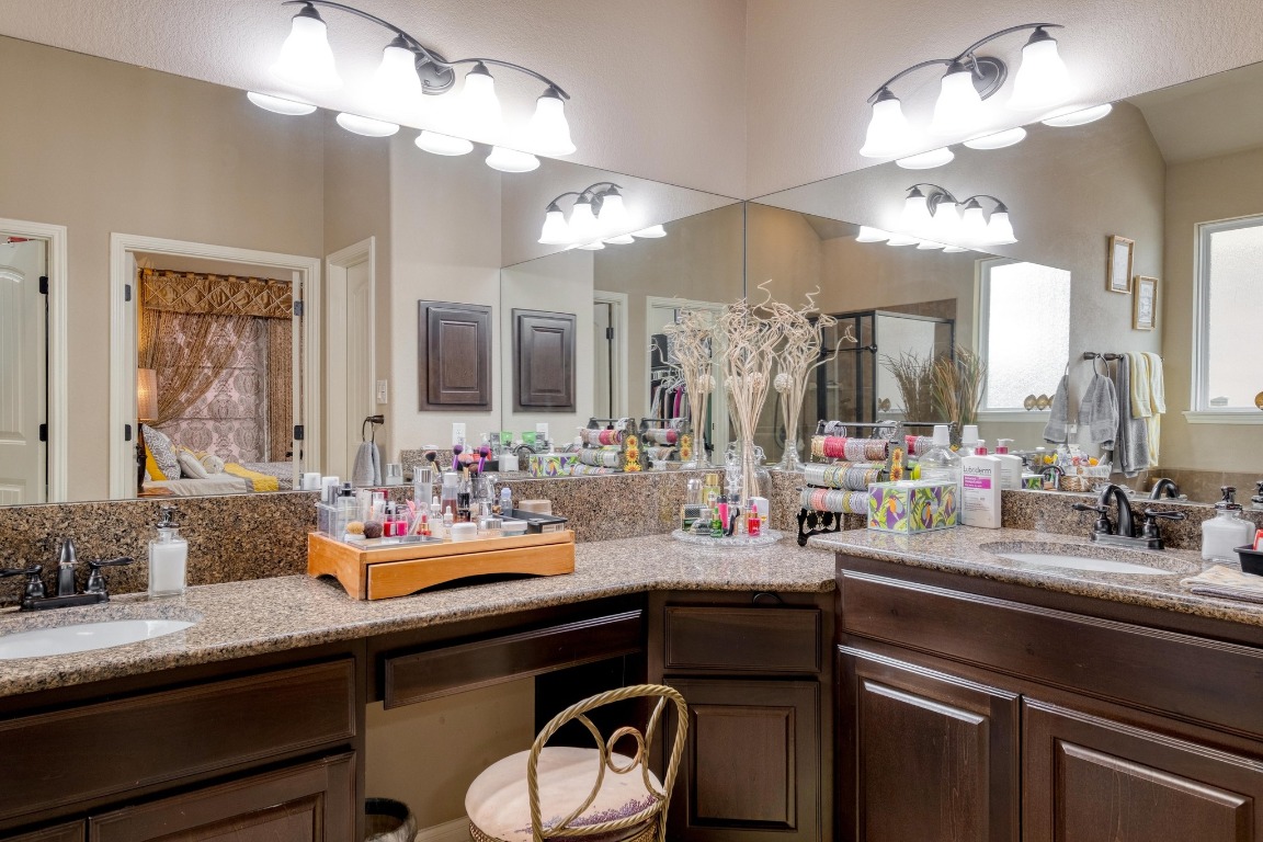 3040 Sachen Street Georgetown, TX 78626 - Photo 17 of 40 a bathroom with a sink and a mirror
