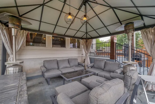 a living room with furniture a couch and a table