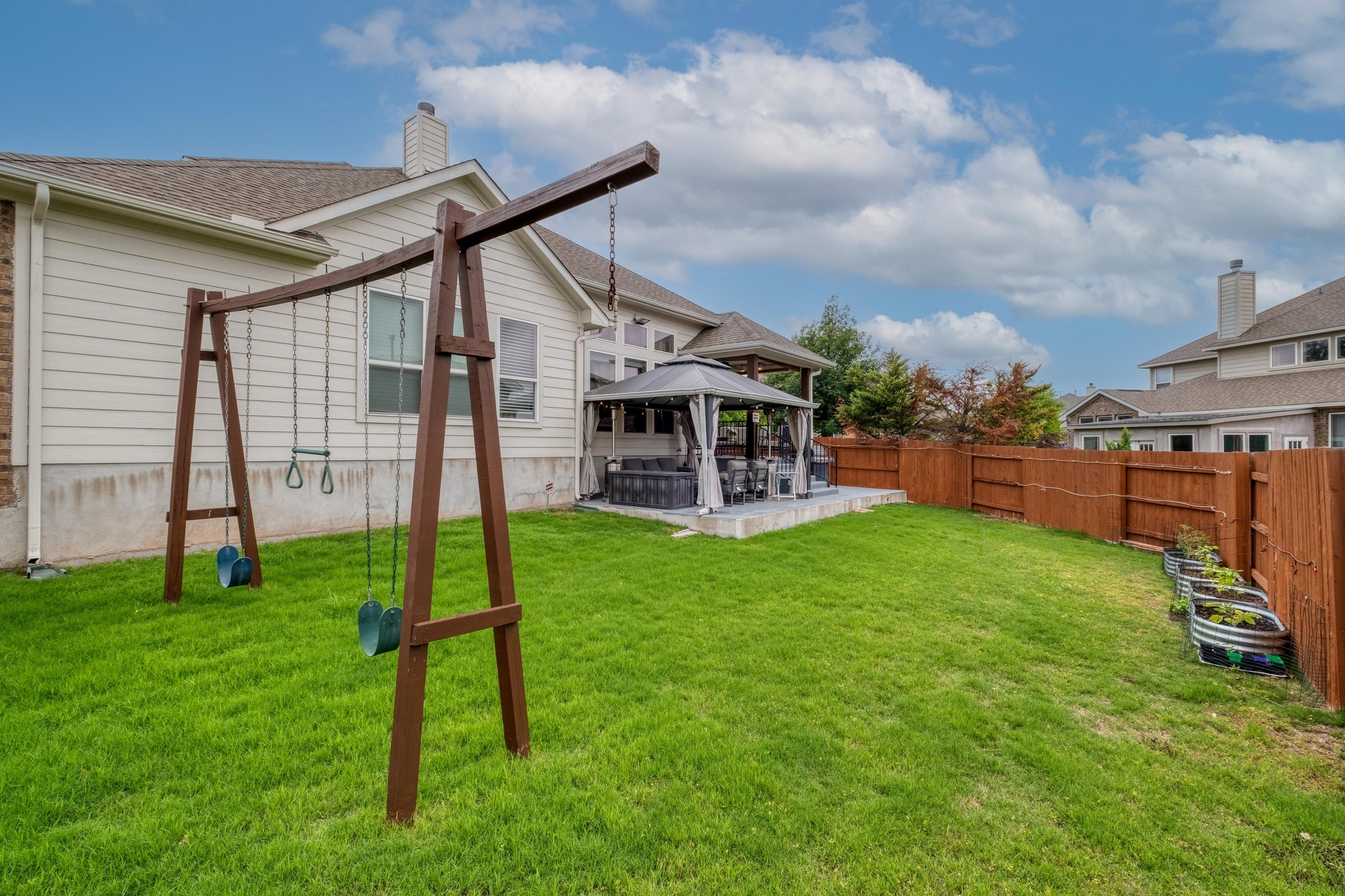 3040 Sachen Street Georgetown, TX 78626 - Photo 35 of 40 a view of a house with a backyard porch and sitting area