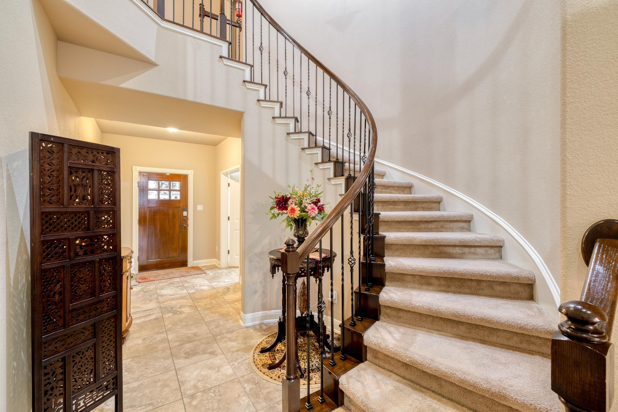 3040 Sachen Street Georgetown, TX 78626 - Photo 5 of 40 Entryway with tile patterned floors, stairway, and a towering ceiling