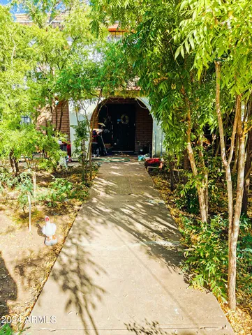 a view of a wooden house with a yard
