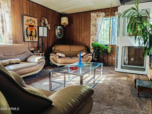 a view of a chairs and table in a patio