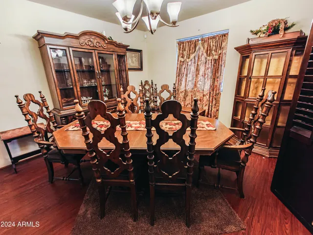 a bedroom with a bed and a table