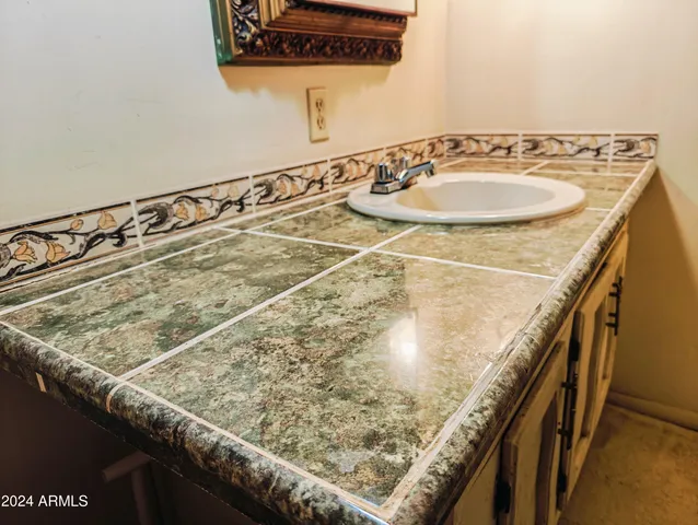 a bed room with a bed and a chair