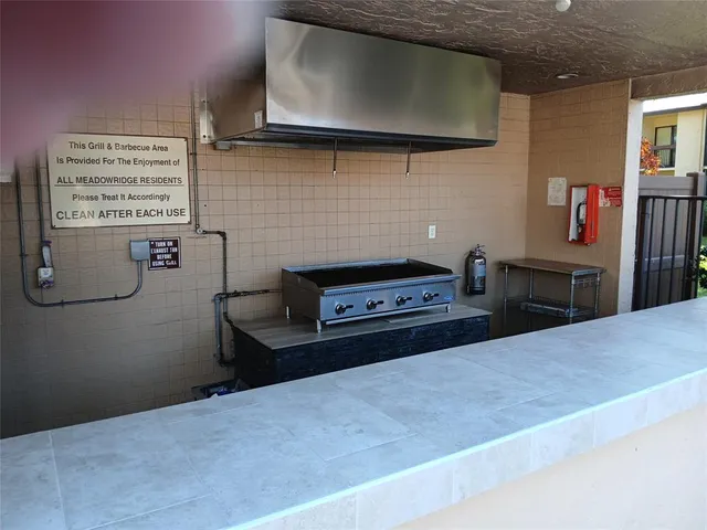 a kitchen with a stove and a microwave
