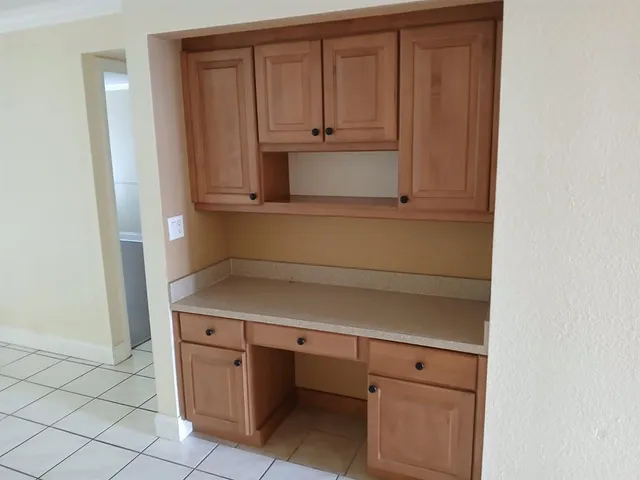 a view of cabinets and window