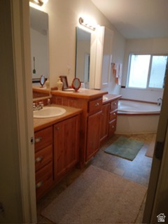1603 South Campground Road, Unit 107 Beaver, UT 84713 - Photo 7 of 11 Dual vanity with wood-finish cabinetry, integrated sinks, and individual mirrors