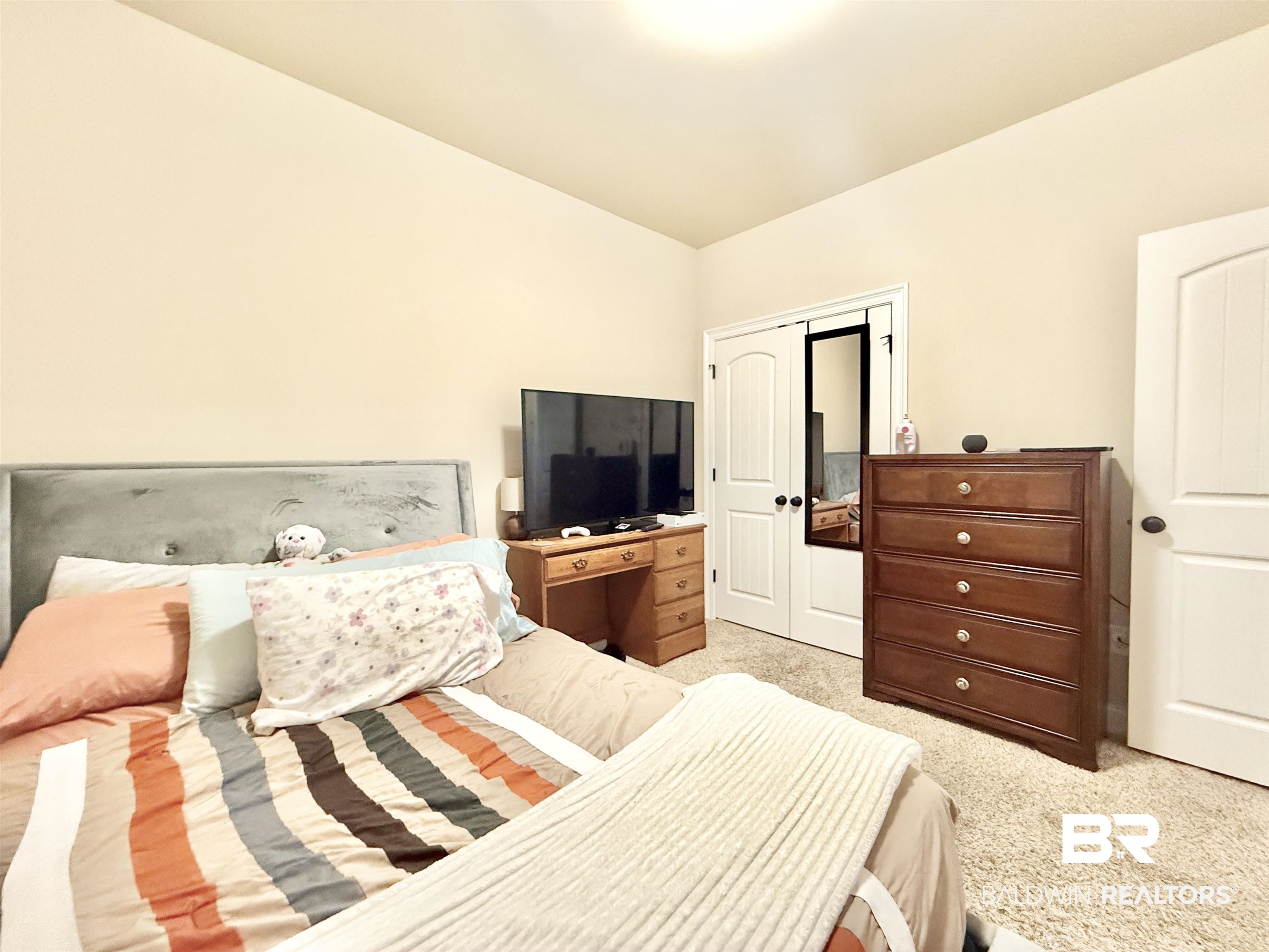 7011 Rocky Rd Loop Gulf Shores, AL 36542 - Photo 39 of 66 Bedroom featuring light carpet and a closet