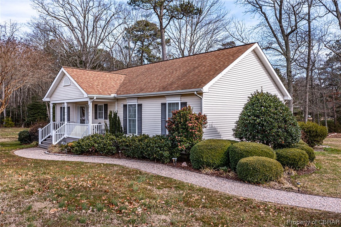 View of front of home featuring covered porch