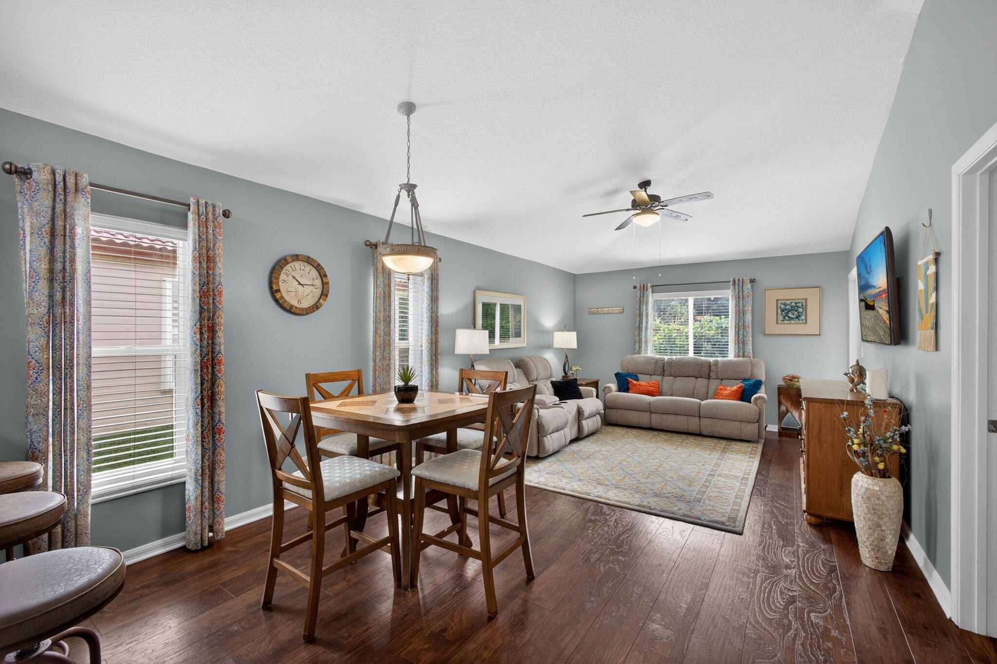 1095 Via Jardin Riviera Beach, FL 33418 - Photo 11 of 44 a view of a dining room with furniture and wooden floor