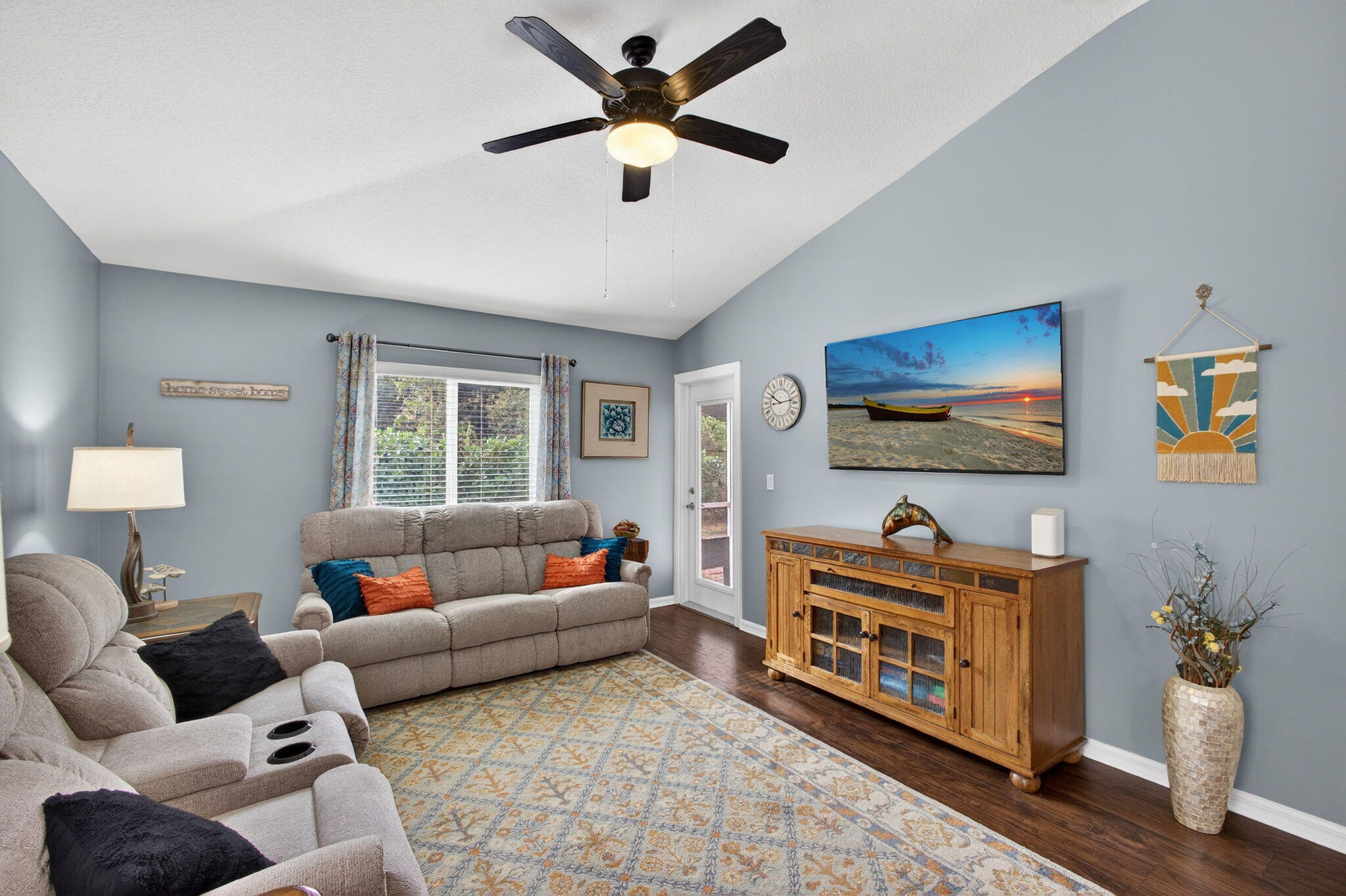1095 Via Jardin Riviera Beach, FL 33418 - Photo 13 of 44 a living room with furniture and a flat screen tv
