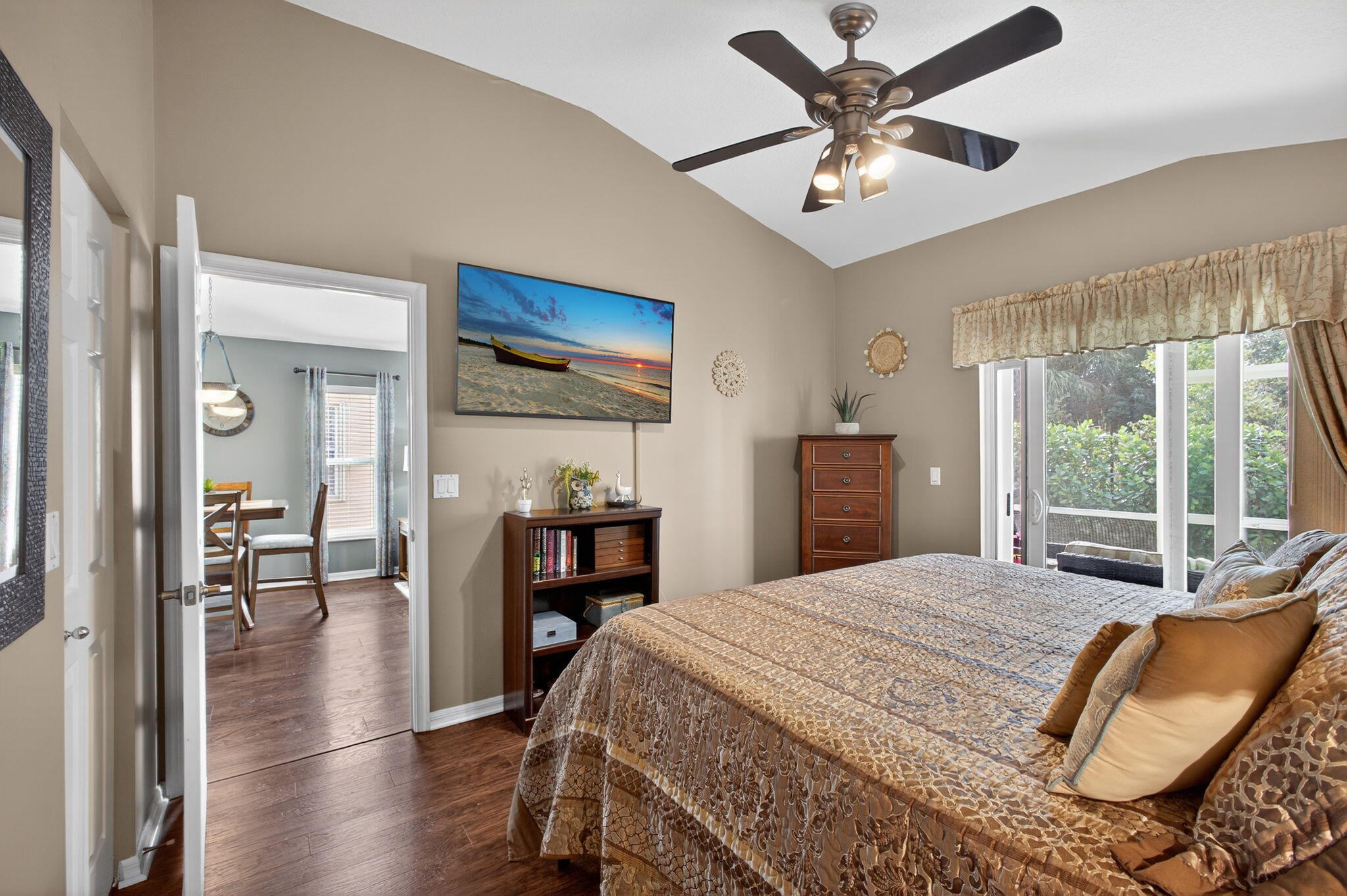 1095 Via Jardin Riviera Beach, FL 33418 - Photo 18 of 44 a bedroom with a bed and a chandelier