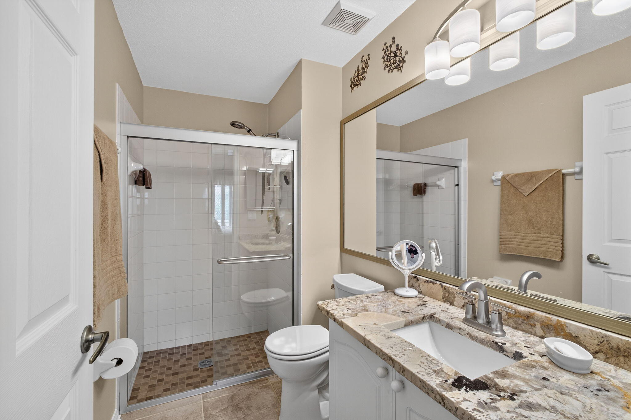 1095 Via Jardin Riviera Beach, FL 33418 - Photo 21 of 44 a bathroom with a granite countertop sink toilet and shower