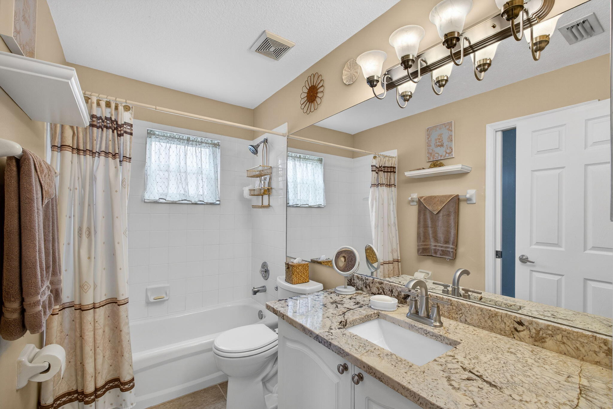 1095 Via Jardin Riviera Beach, FL 33418 - Photo 25 of 44 a bathroom with a granite countertop sink toilet and shower