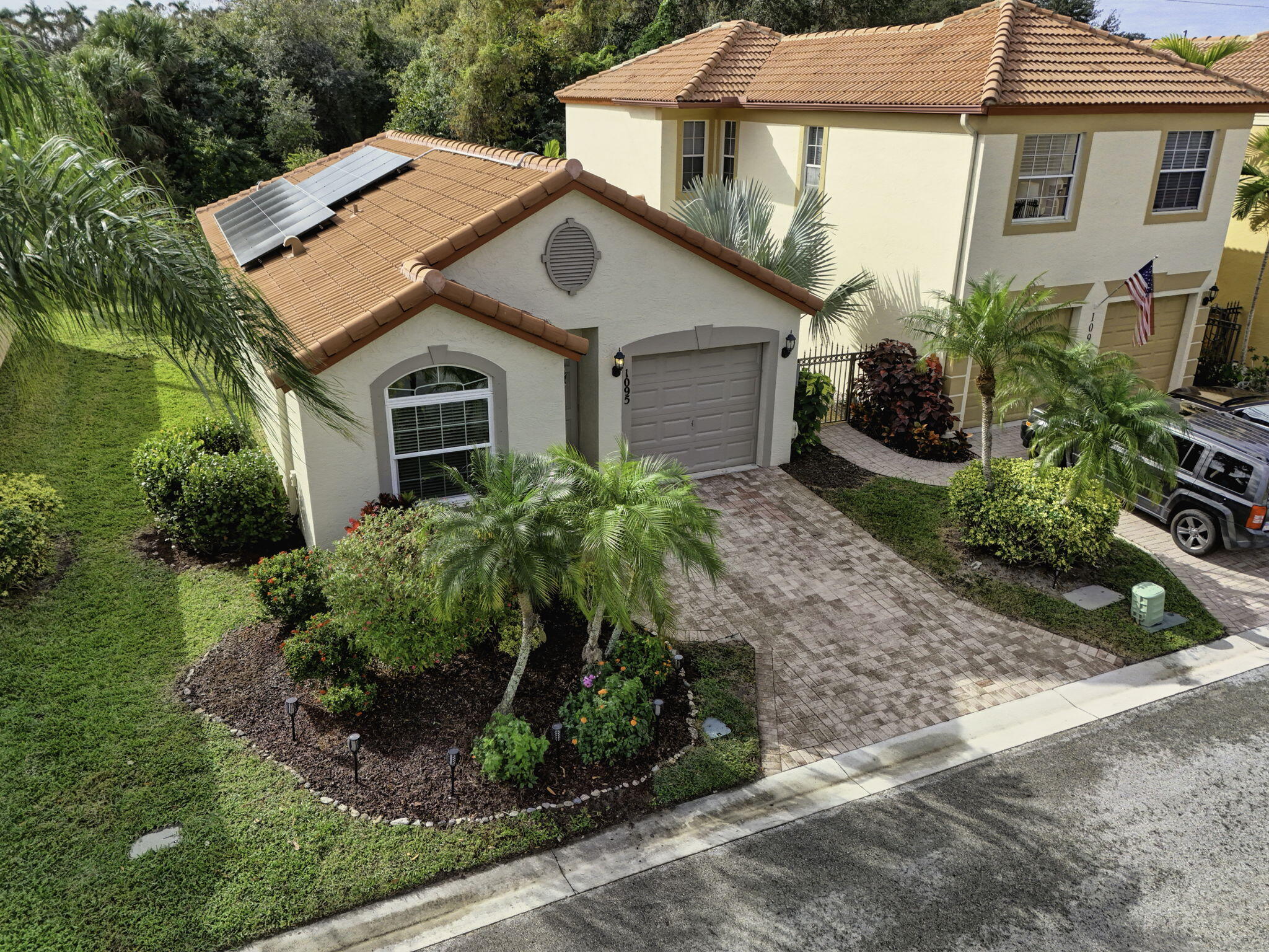 1095 Via Jardin Riviera Beach, FL 33418 - Photo 3 of 44 a house view with a outdoor space