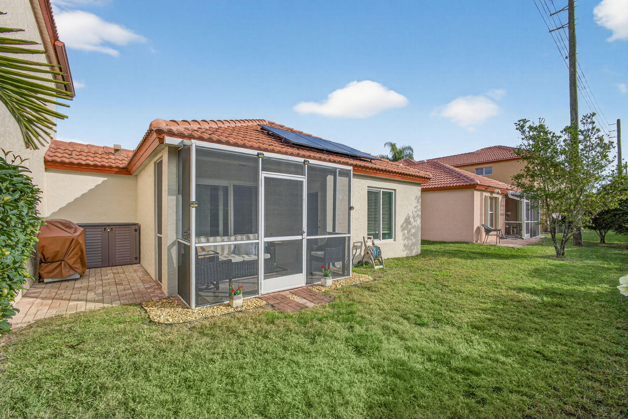 1095 Via Jardin Riviera Beach, FL 33418 - Photo 31 of 44 a view of a house with a yard