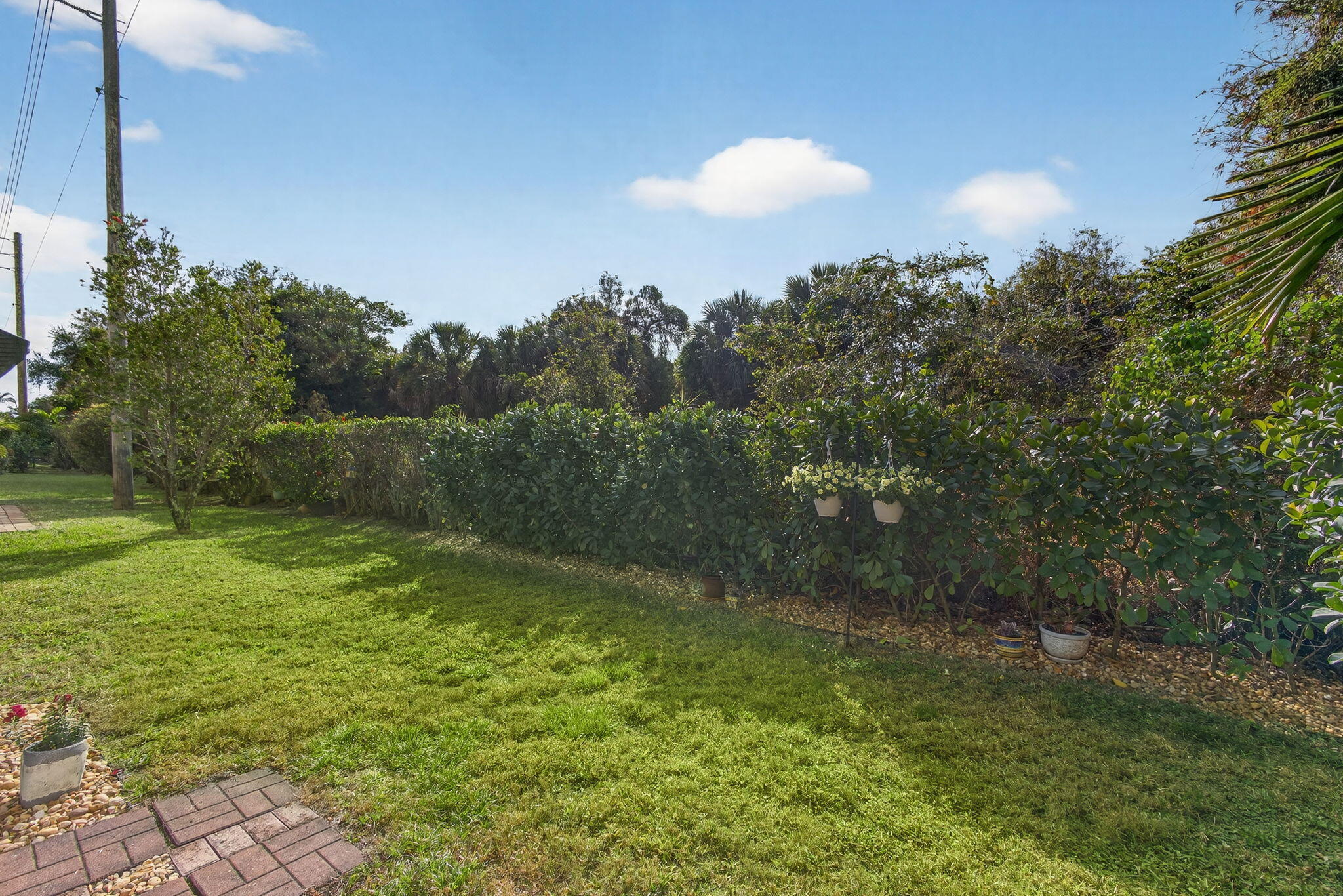 1095 Via Jardin Riviera Beach, FL 33418 - Photo 34 of 44 a view of outdoor space and yard