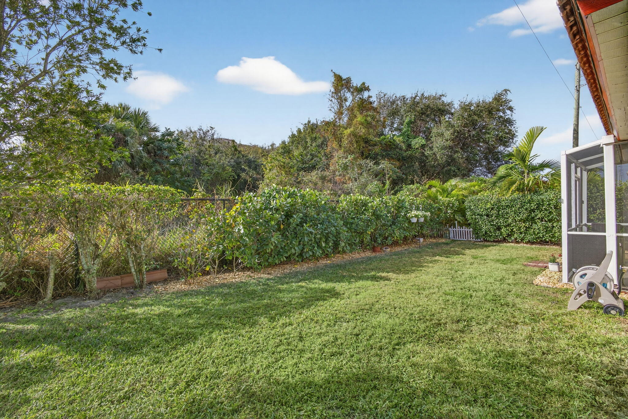 1095 Via Jardin Riviera Beach, FL 33418 - Photo 35 of 44 a view of a backyard