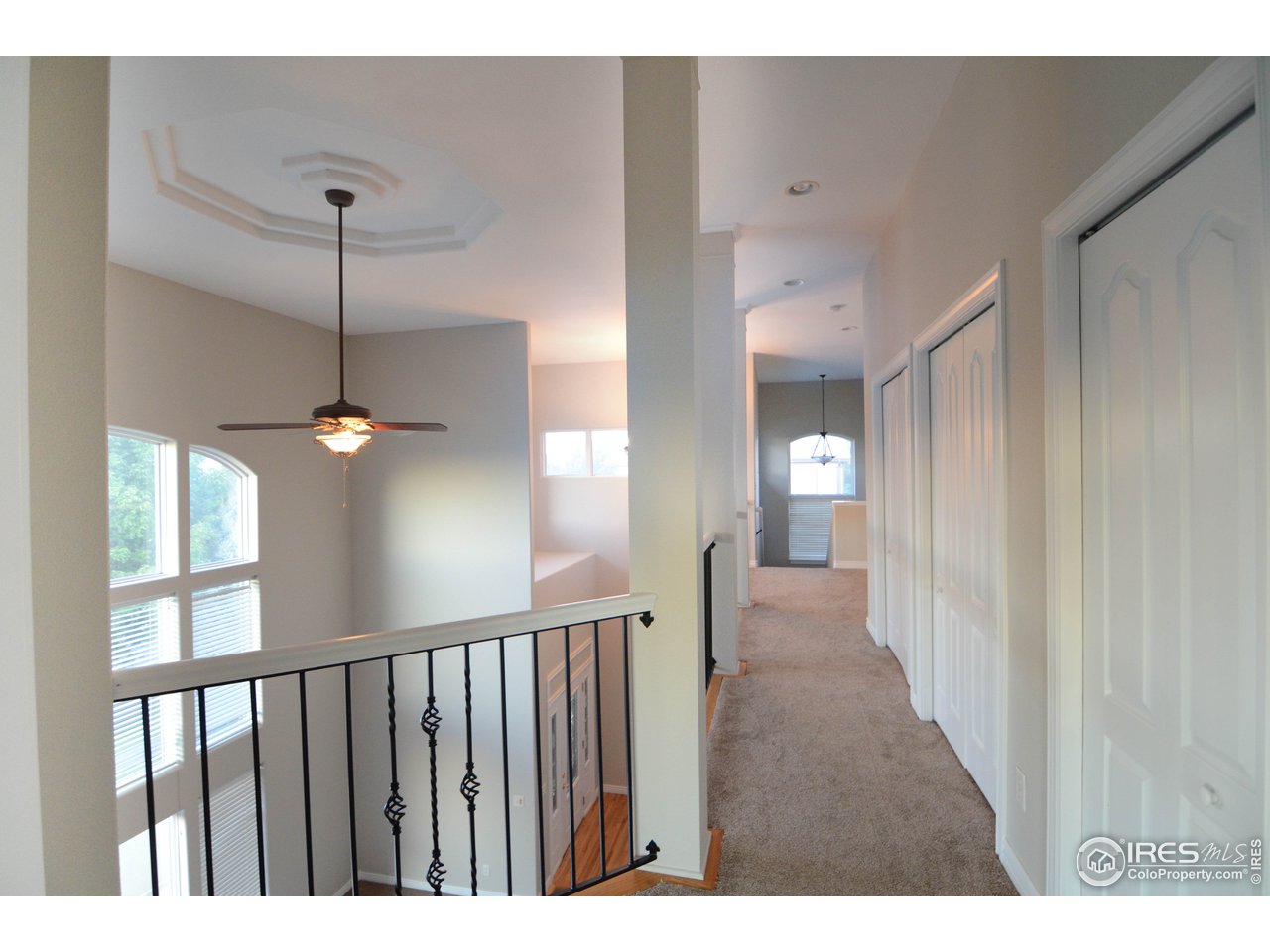 1797 Ridge W Drive Windsor, CO 80550 - Photo 16 of 33 a view of a hallway with a window
