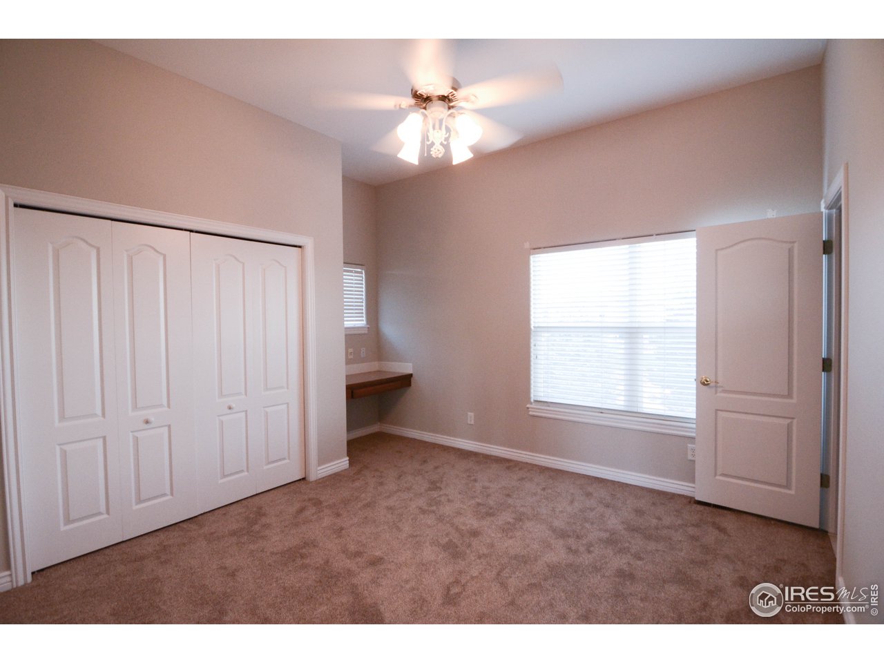 1797 Ridge W Drive Windsor, CO 80550 - Photo 17 of 33 a view of an empty room with a window
