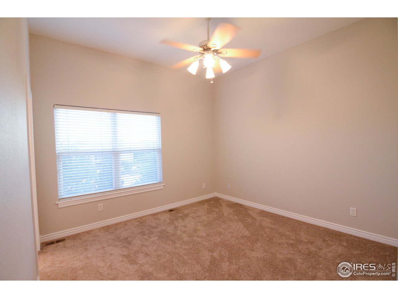 1797 Ridge W Drive Windsor, CO 80550 - Photo 19 of 33 a view of an empty room with a window