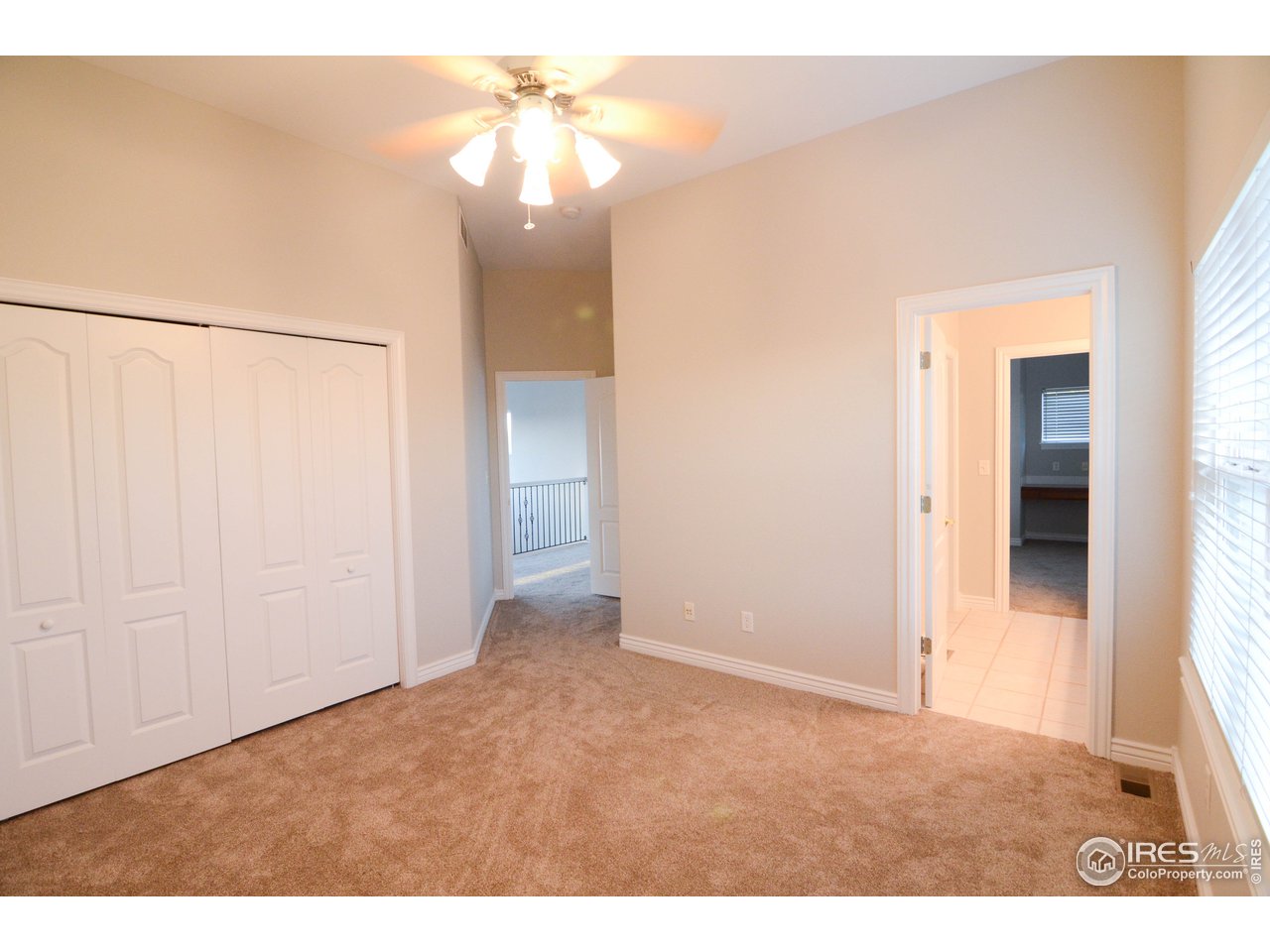 1797 Ridge W Drive Windsor, CO 80550 - Photo 20 of 33 a view of an empty room and chandelier fan