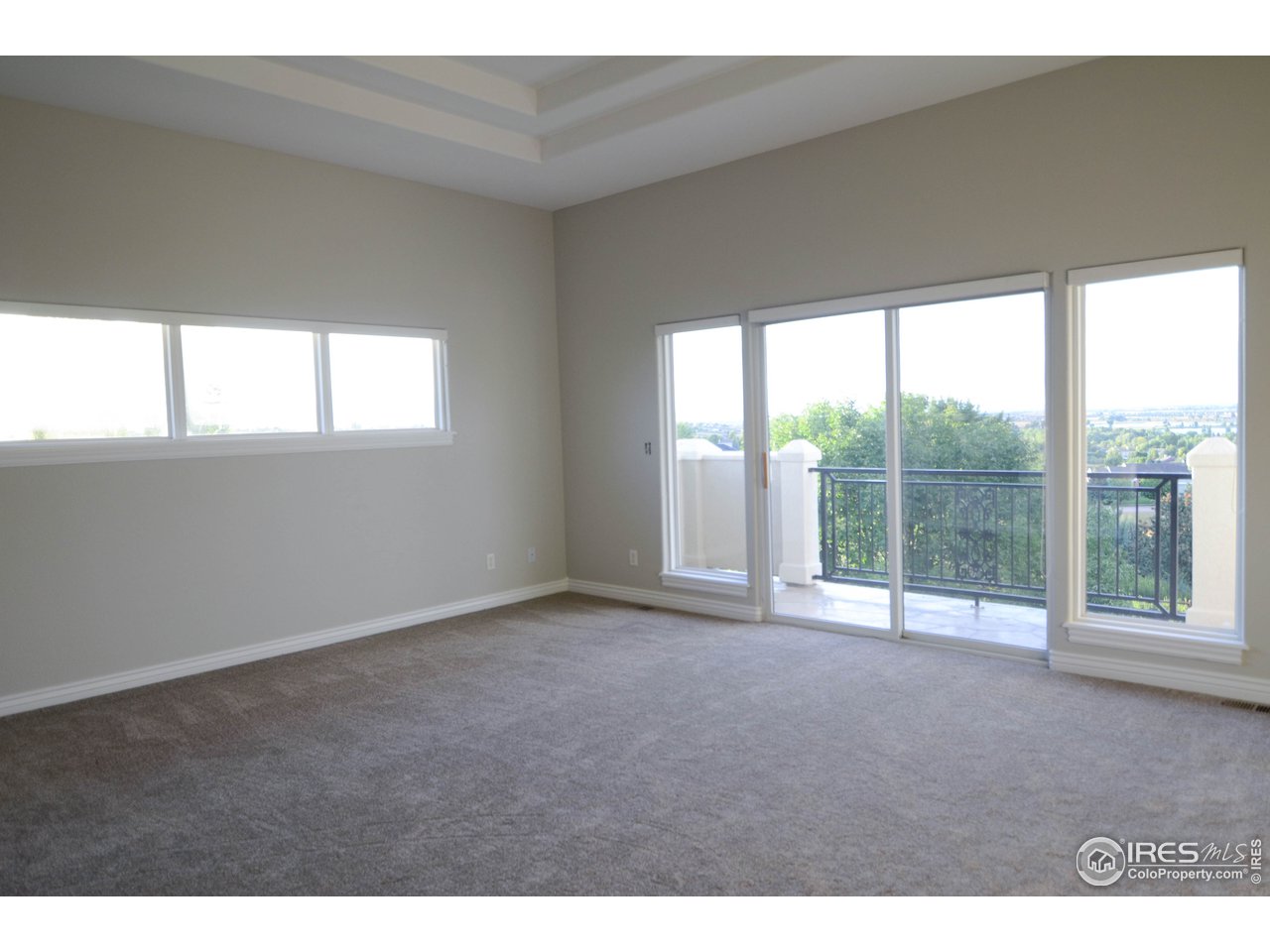 1797 Ridge W Drive Windsor, CO 80550 - Photo 21 of 33 a view of an empty room with a window