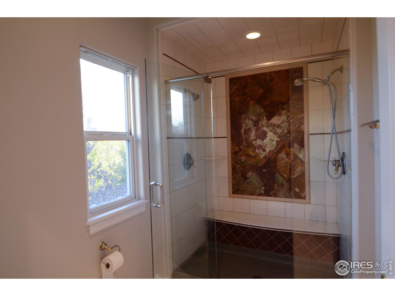 1797 Ridge W Drive Windsor, CO 80550 - Photo 25 of 33 a view of a glass door and a window