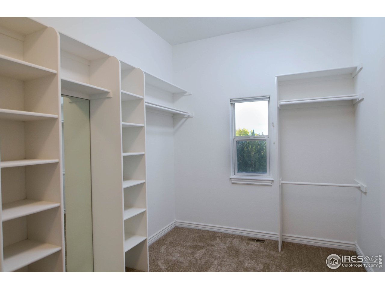 1797 Ridge W Drive Windsor, CO 80550 - Photo 27 of 33 a view of an empty room with a window