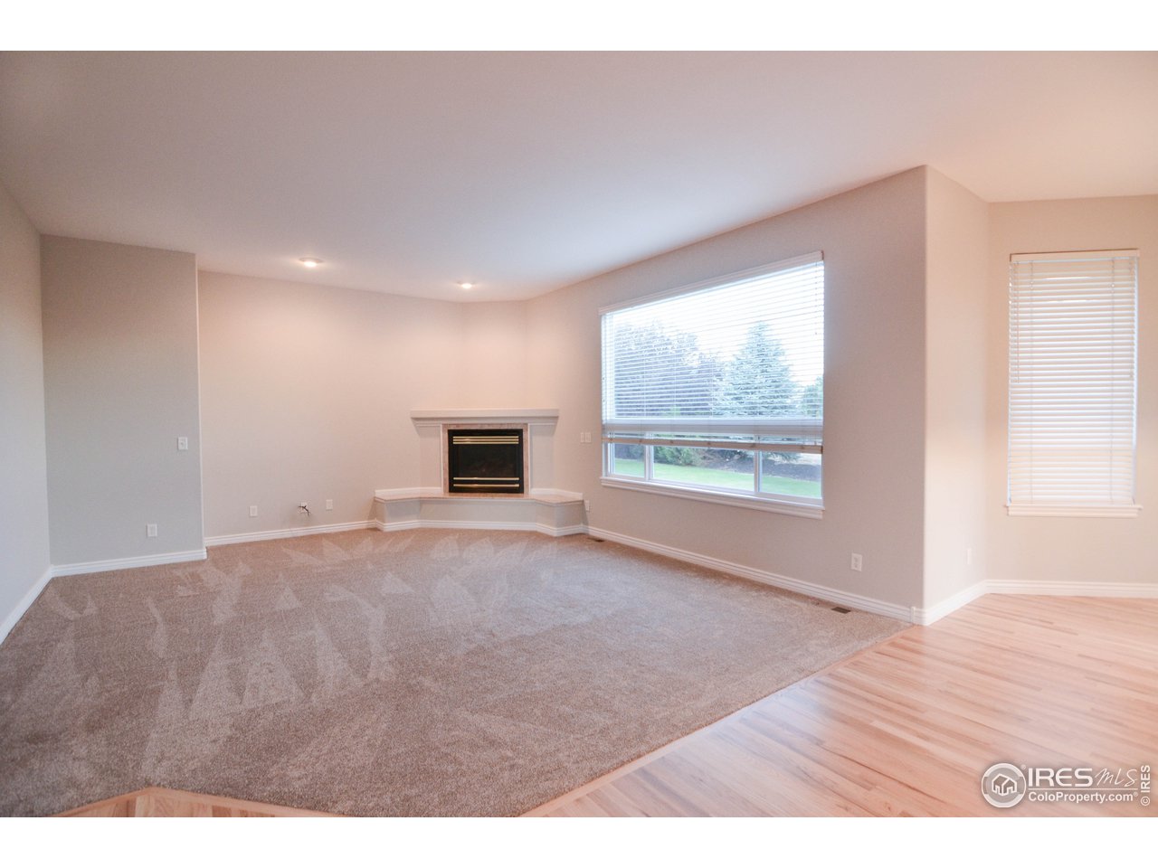 1797 Ridge W Drive Windsor, CO 80550 - Photo 6 of 33 a view of empty room with wooden floor and fan