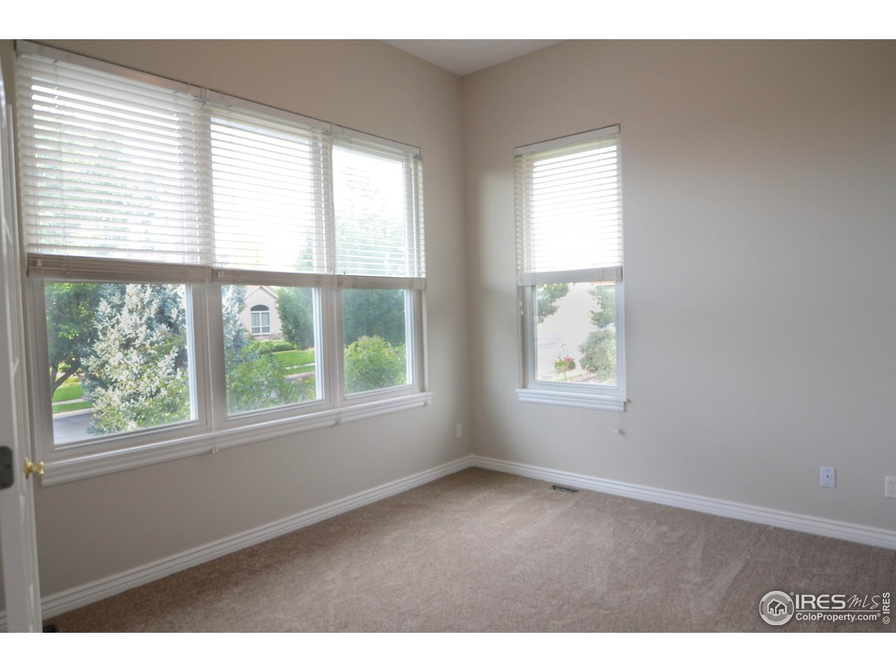 1797 Ridge W Drive Windsor, CO 80550 - Photo 7 of 33 a view of an empty room with a window