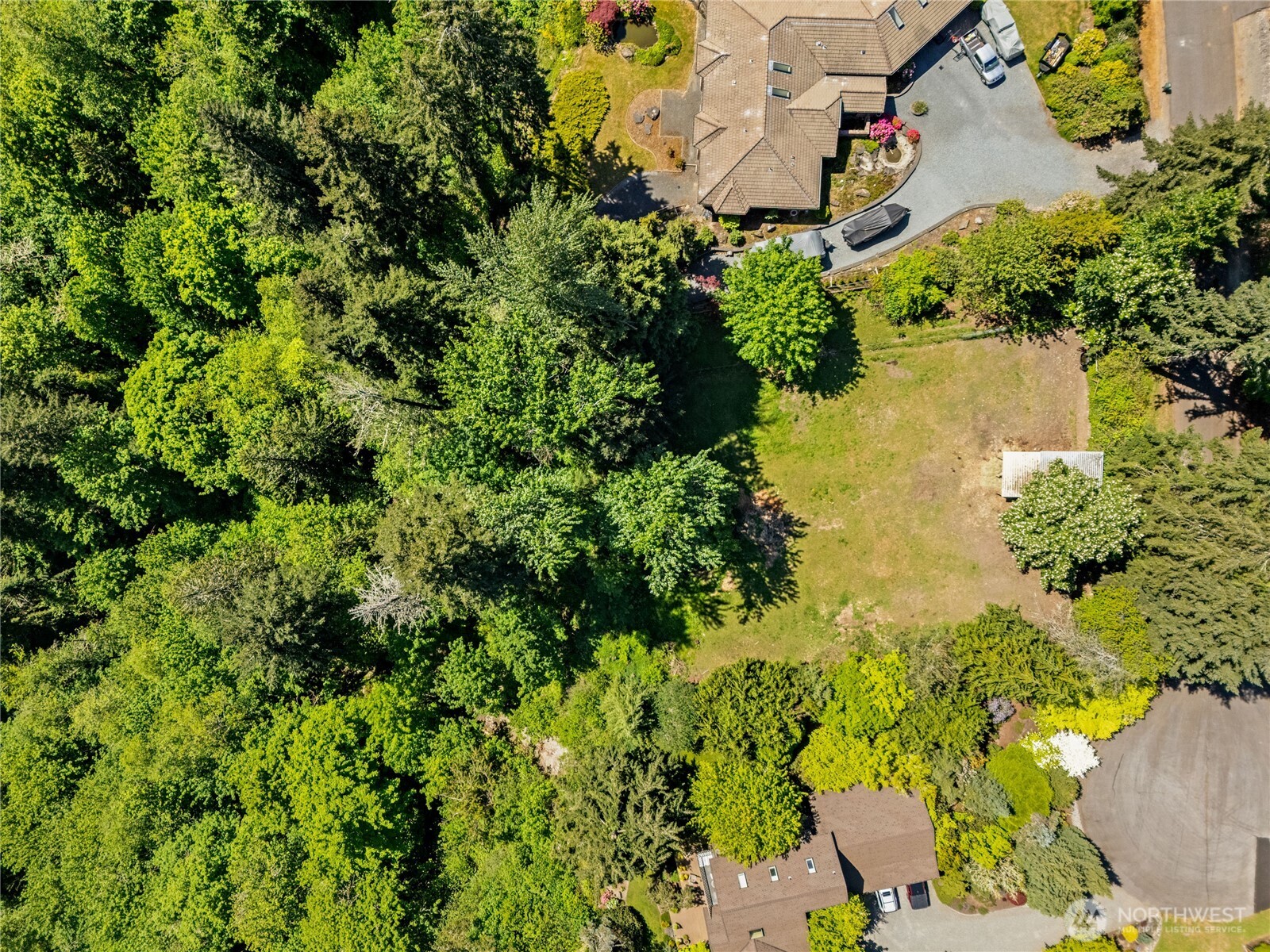 23519 Rim Road Graham, WA 98338 - Photo 15 of 23 an aerial view of residential house with swimming pool and lawn chairs