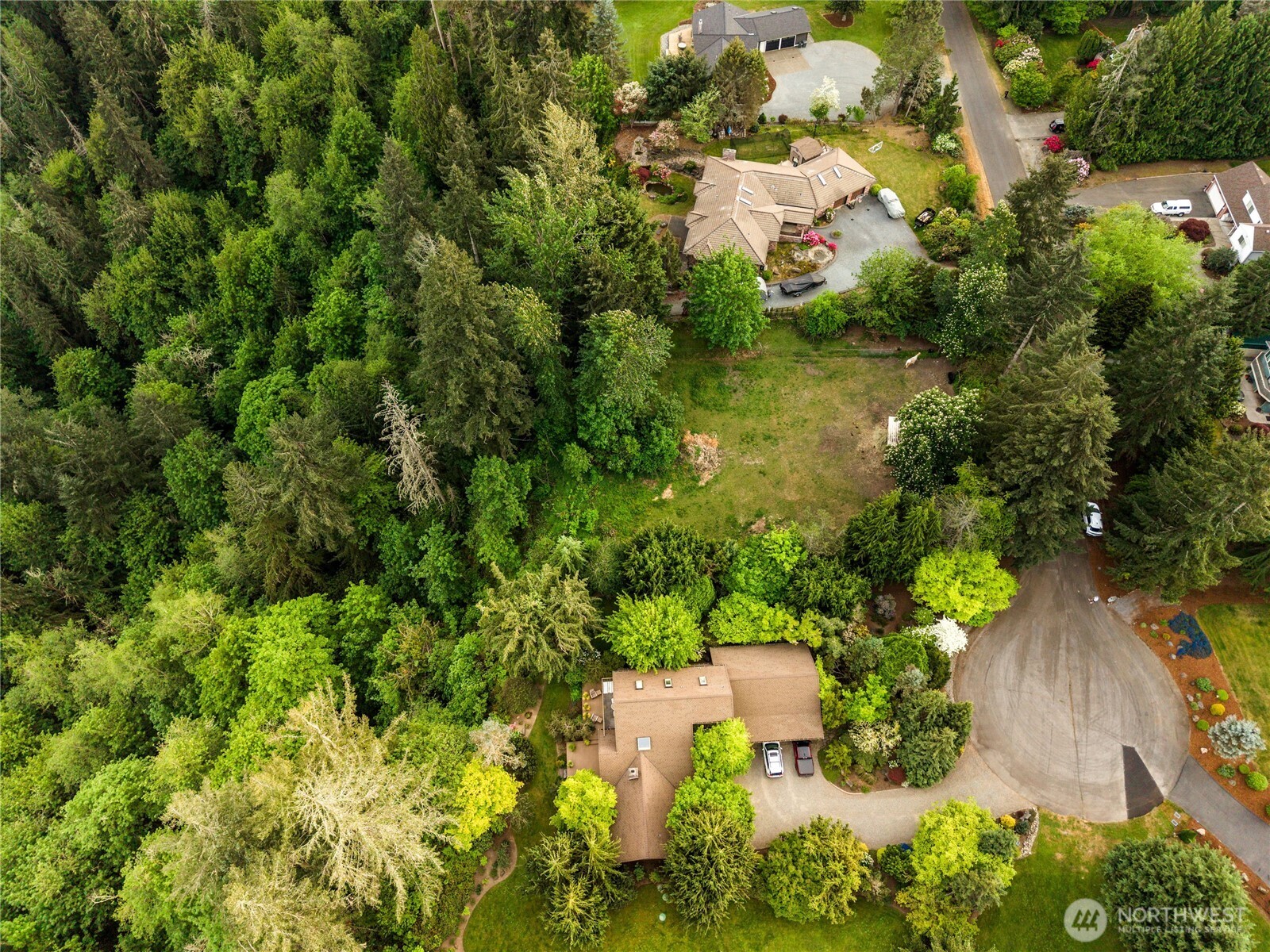 23519 Rim Road Graham, WA 98338 - Photo 23 of 23 an aerial view of residential house with outdoor space and trees all around