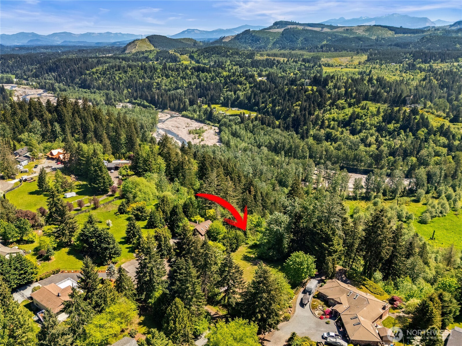 23519 Rim Road Graham, WA 98338 - Photo 3 of 23 a view of a city with lush green forest