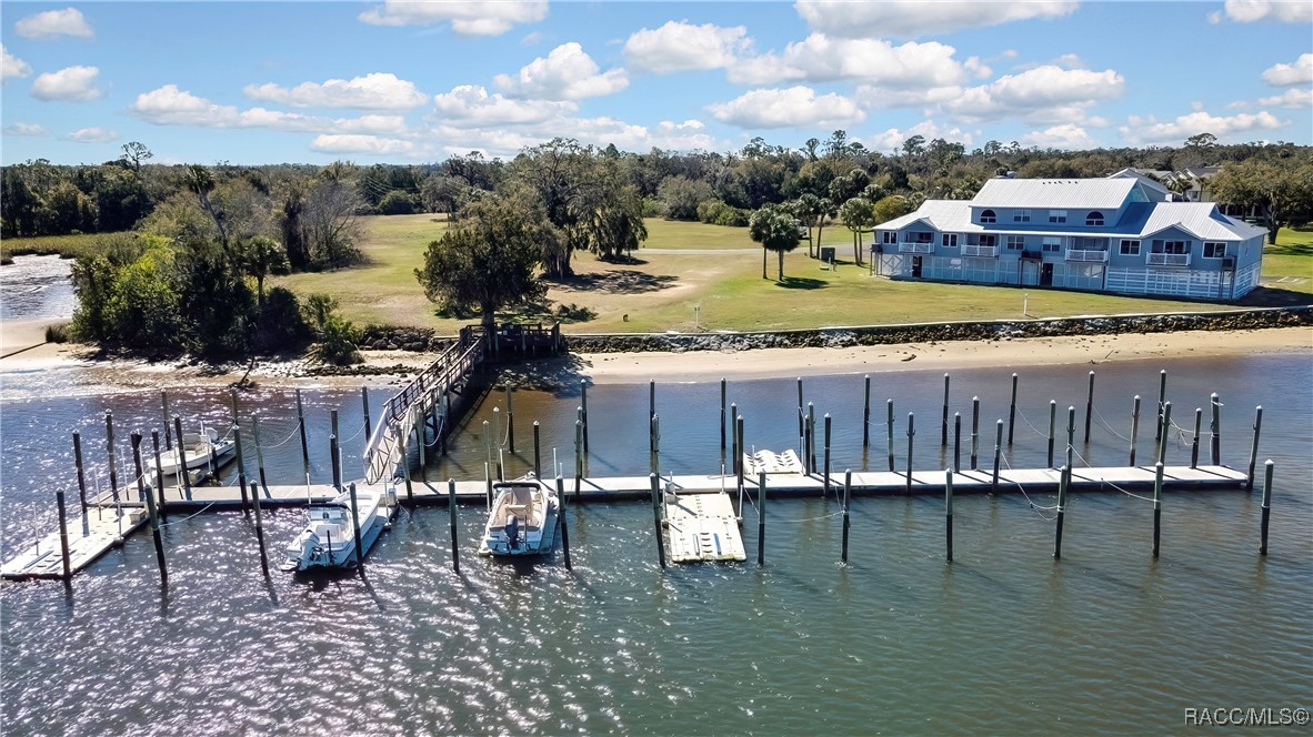 2855 North Rivers Edge Boulevard, Unit 213 Crystal River, FL 34429 - Photo 58 of 62 a view of a lake with a house
