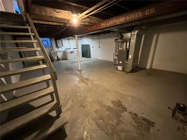 a view of an empty room with stairs