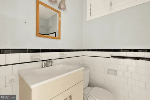 a bathroom with a toilet sink and shower
