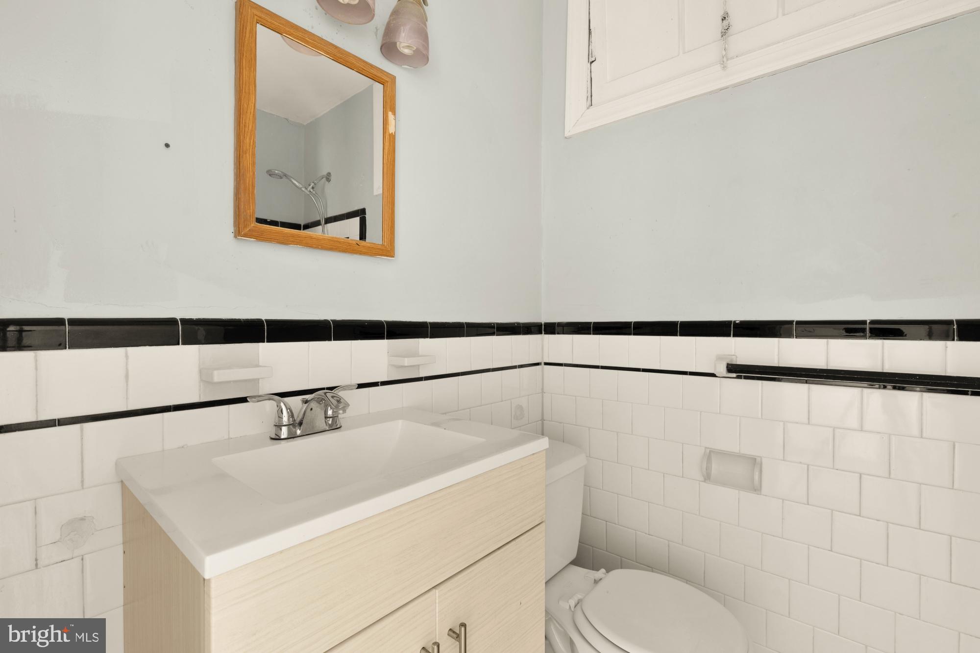 1227 18th Place Northeast Washington, DC 20002 - Photo 11 of 23 a bathroom with a toilet sink and shower