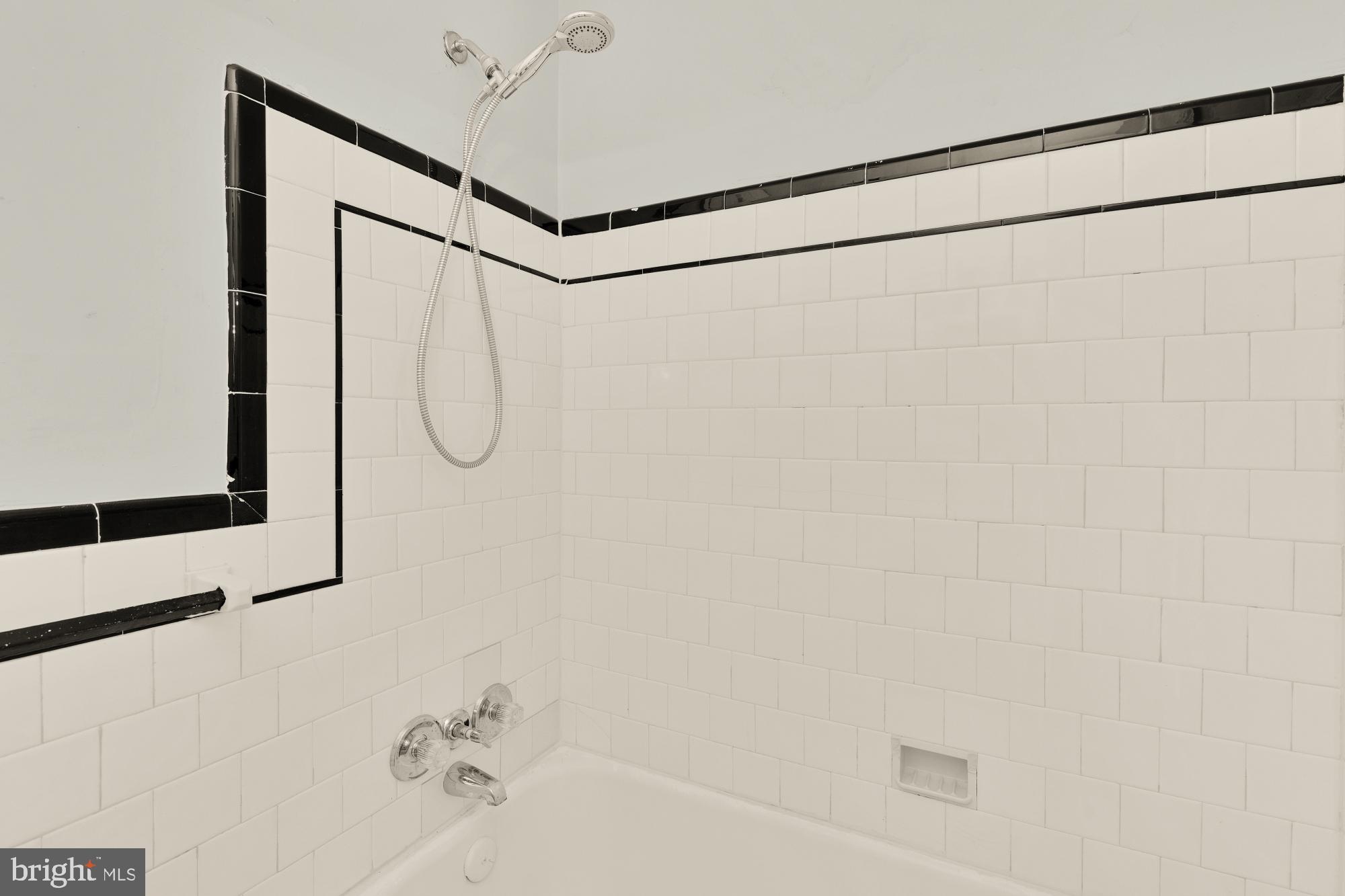 1227 18th Place Northeast Washington, DC 20002 - Photo 13 of 23 a bathroom with a shower and a mirror