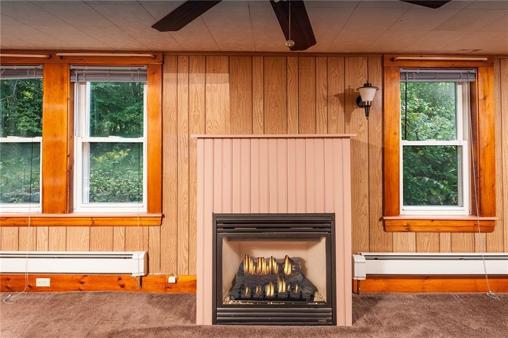 29 Brave Boat Harbor Road York, ME 03909 - Photo 15 of 32 Living room features a gas fireplace.