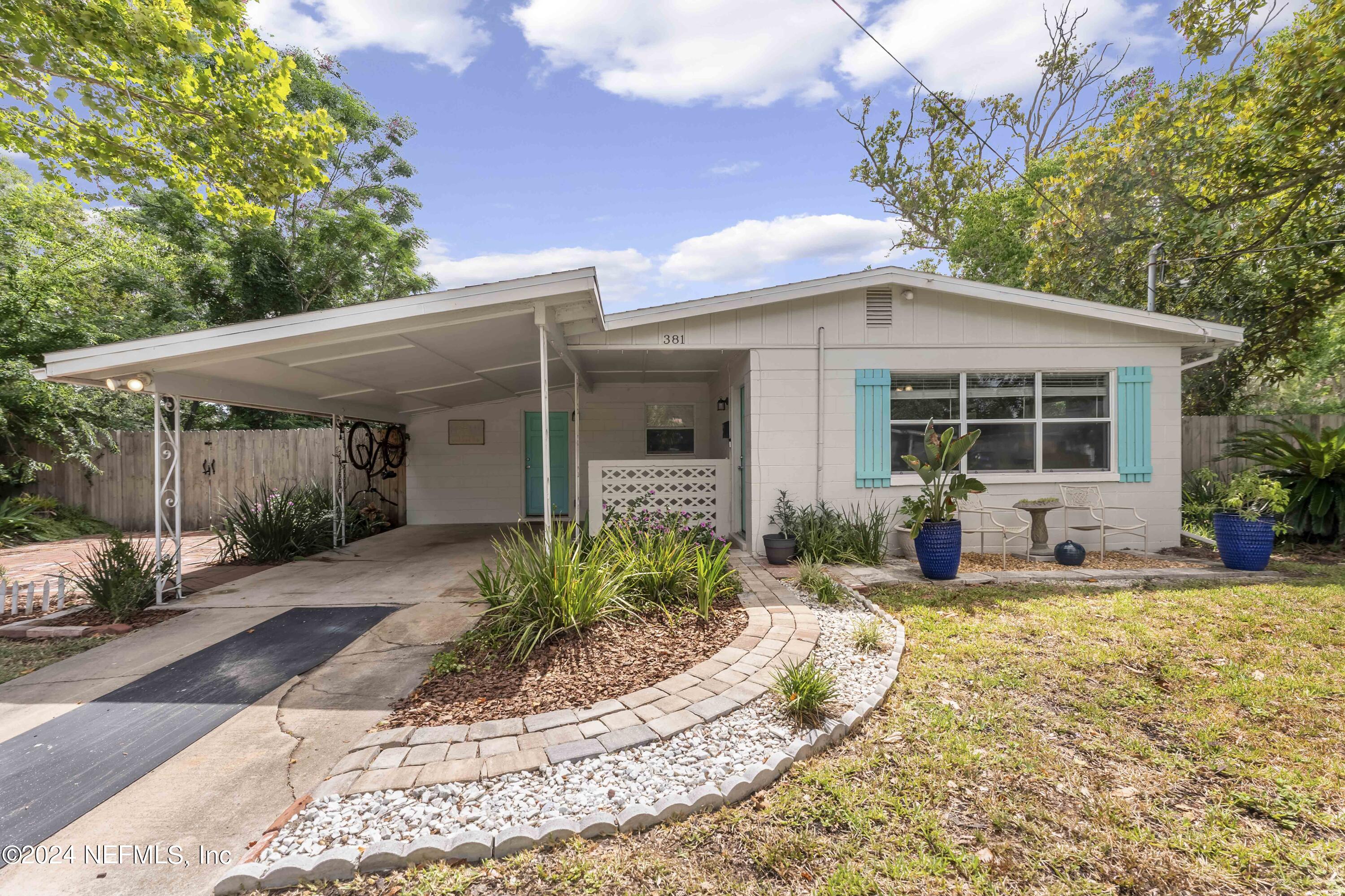 381 Sargo Road Atlantic Beach, FL 32233 - Photo 1 of 24 a front view of a house with a patio