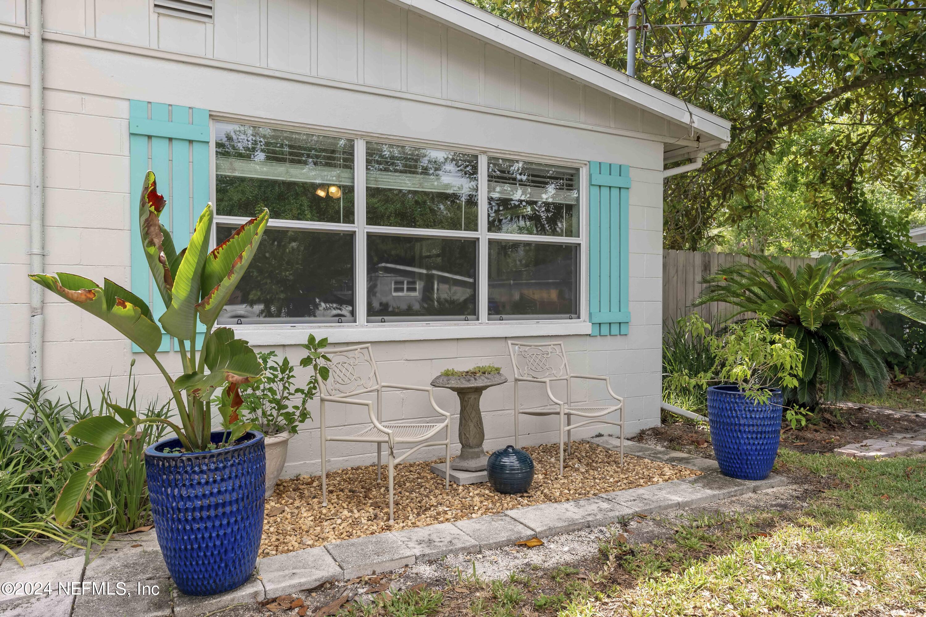 381 Sargo Road Atlantic Beach, FL 32233 - Photo 3 of 24 a potted plant sitting in front of a house
