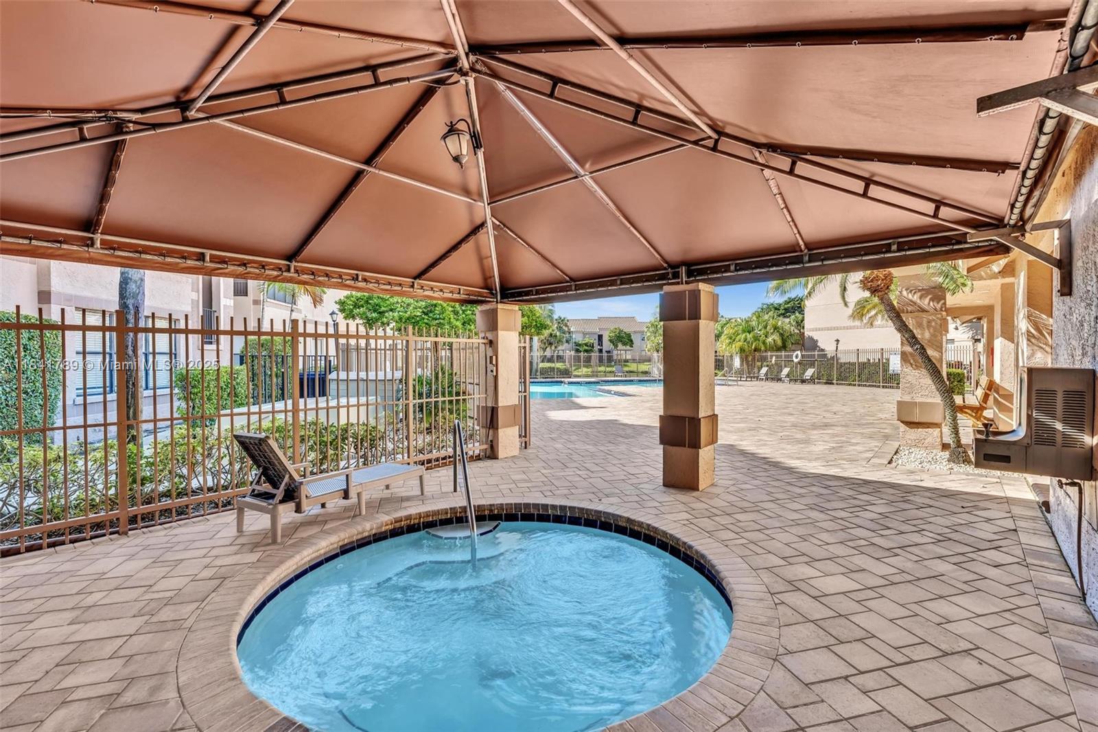 2796 South University Drive, Unit 2104 Davie, FL 33328 - Photo 31 of 41 a view of outdoor space with swimming pool