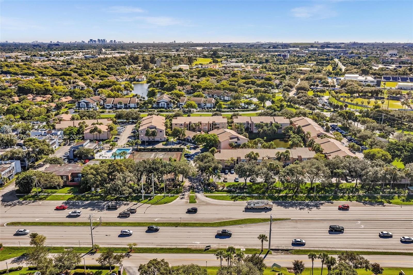 2796 South University Drive, Unit 2104 Davie, FL 33328 - Photo 40 of 41 an aerial view of residential building and parking space